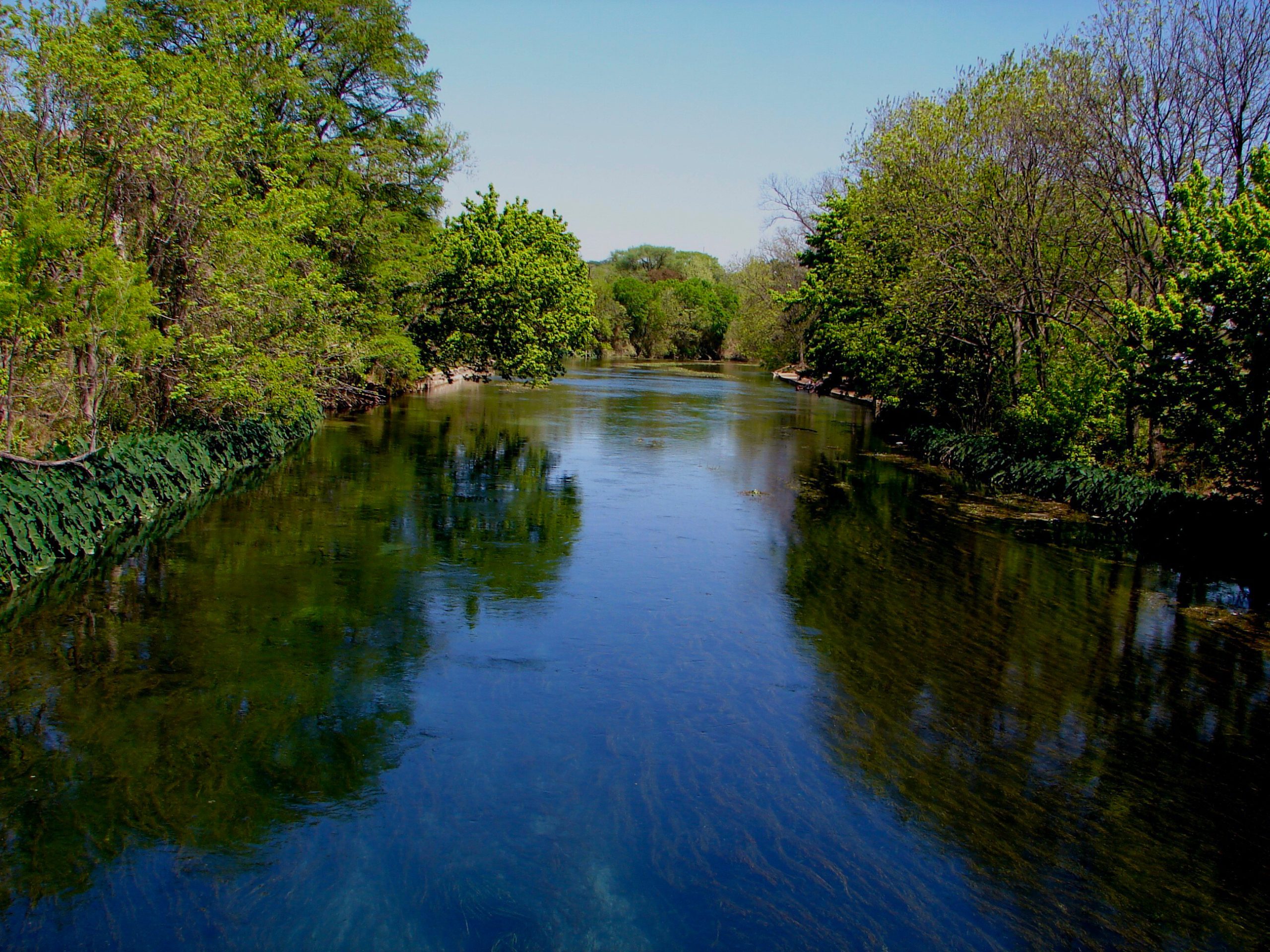 Calm section of the San Marcos River near popular trails and parks